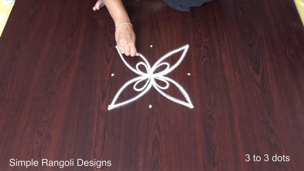 3 into 3 pulli kolam 709