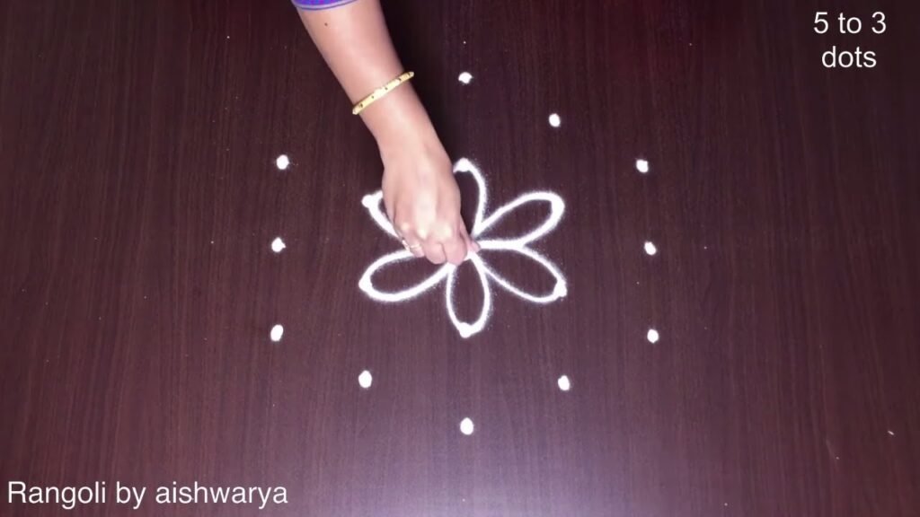 5 middle dots rose rangoli