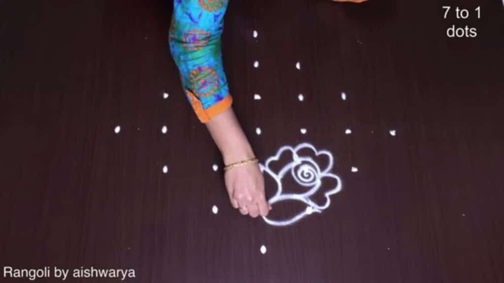 7 dots rose flower rangoli