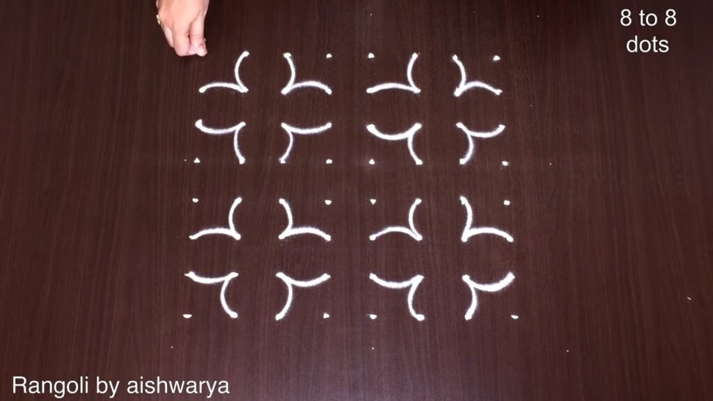 hand rangoli with 8 dots
