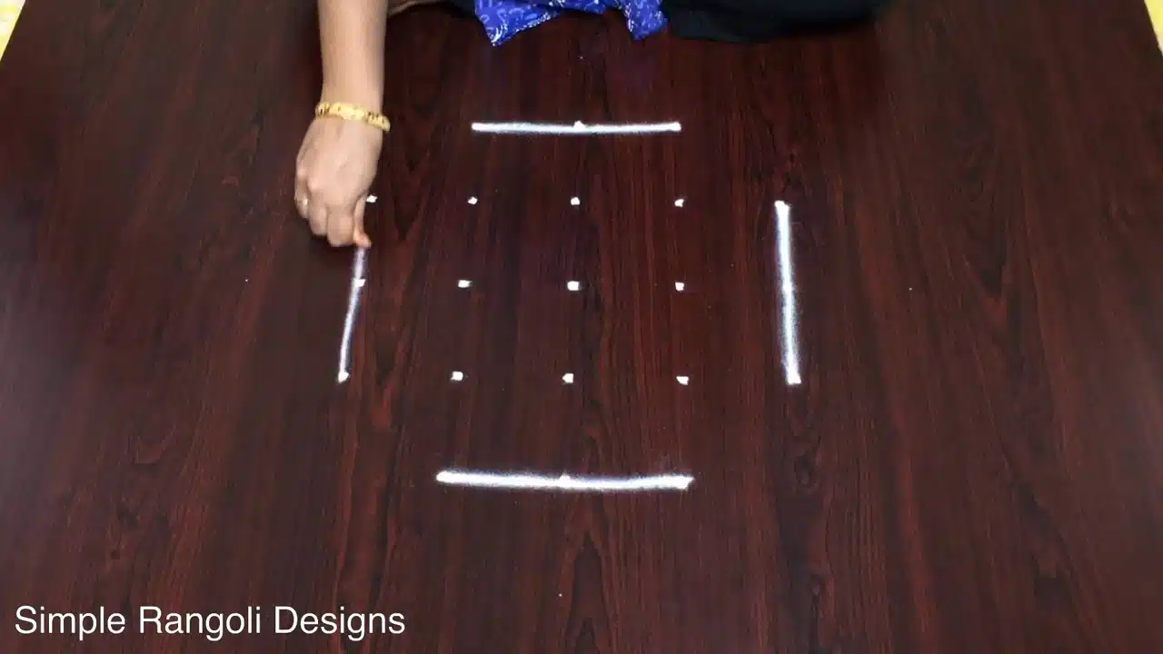 5-to-3 dot alpona