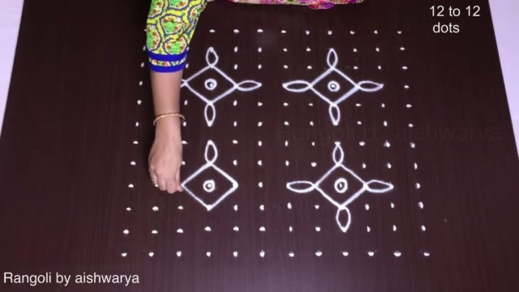 Diwali kolam with mud lamps