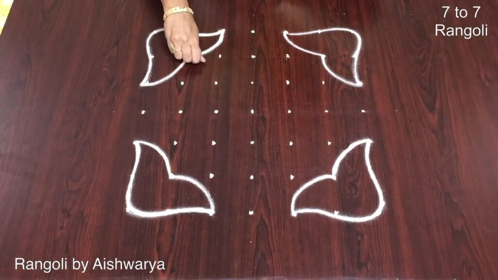 flower rangoli with 7 dots