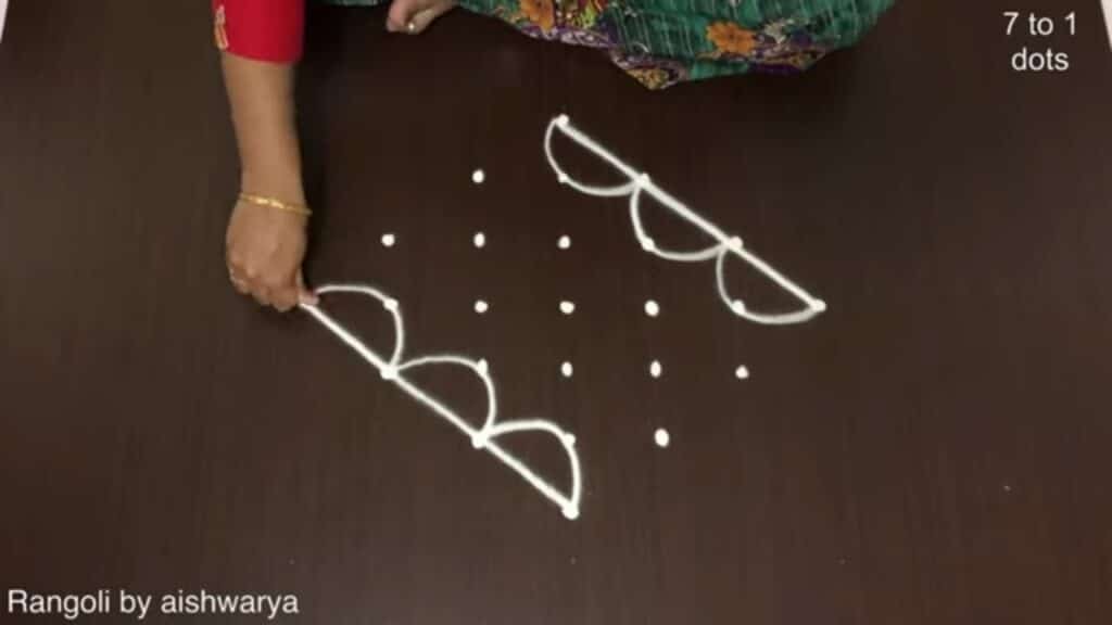 eight-diya Diwali rangoli