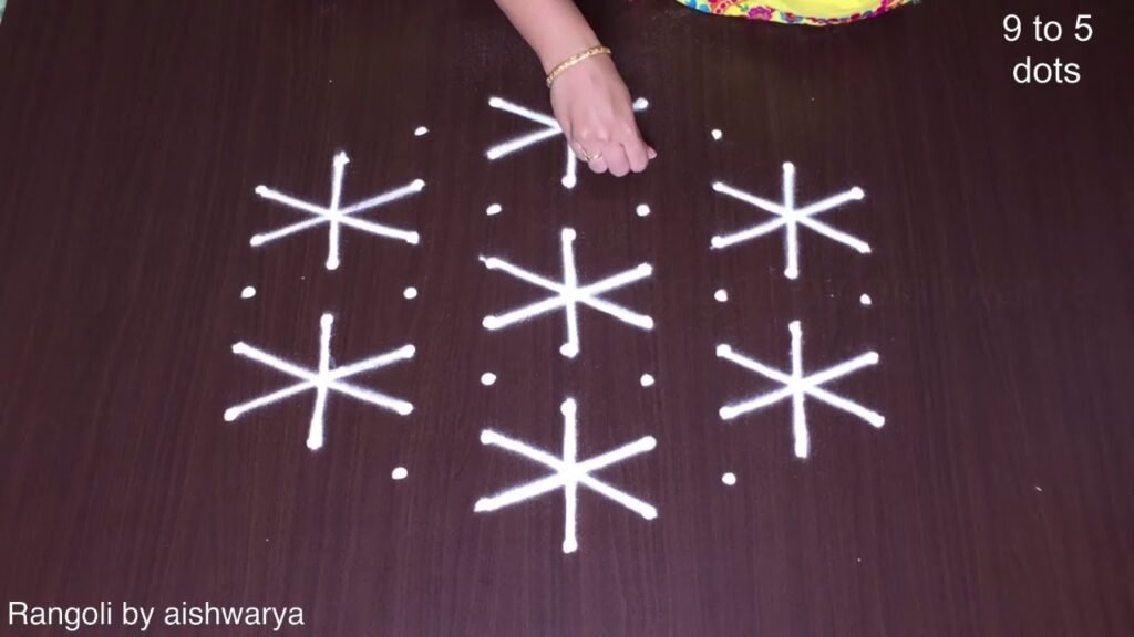 9 dots hand rangoli